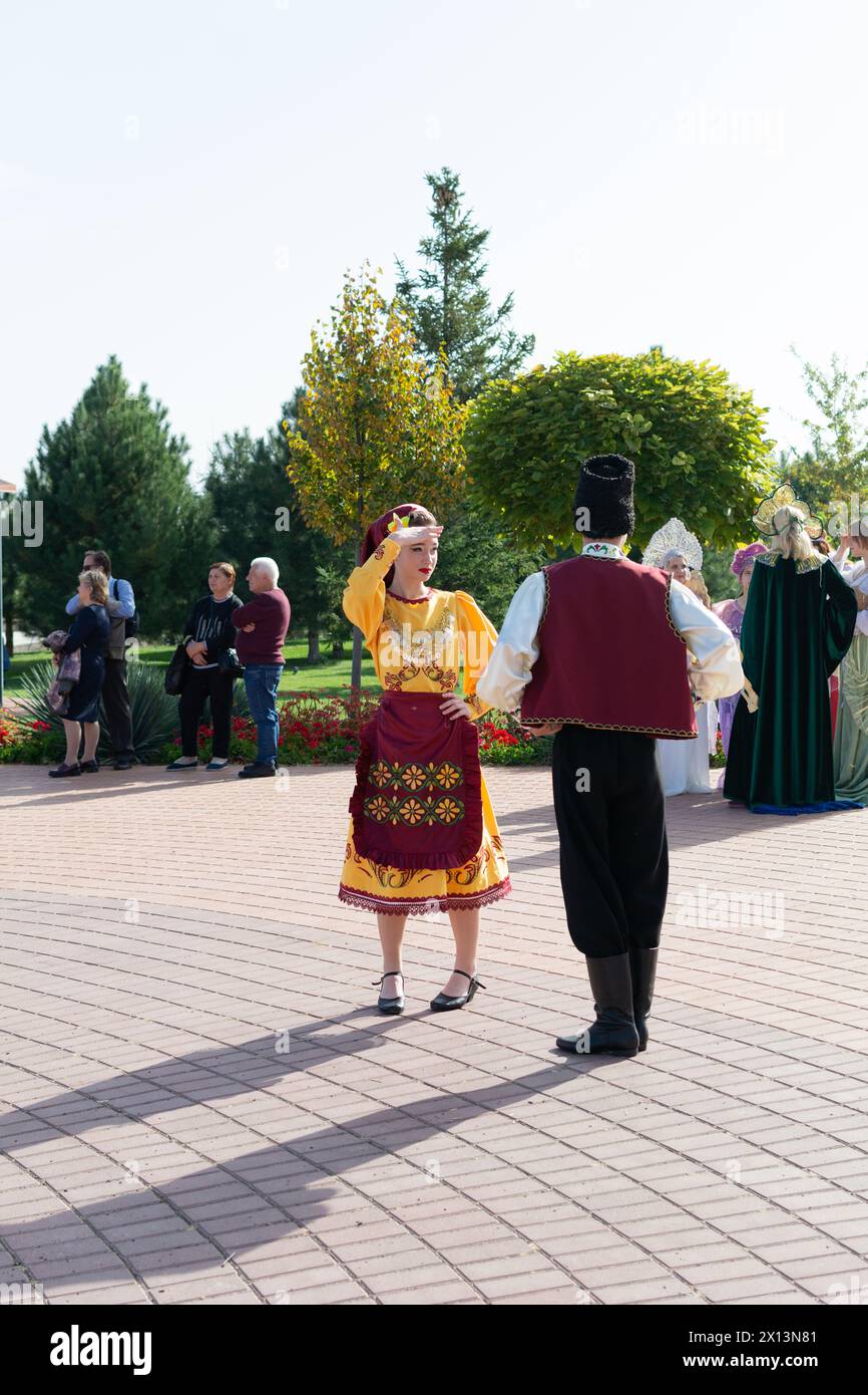 Bender, Tiraspol - October, 2023 a woman and a man in national Moldavian costumes at a festival of wine in Moldova. Stock Photo
