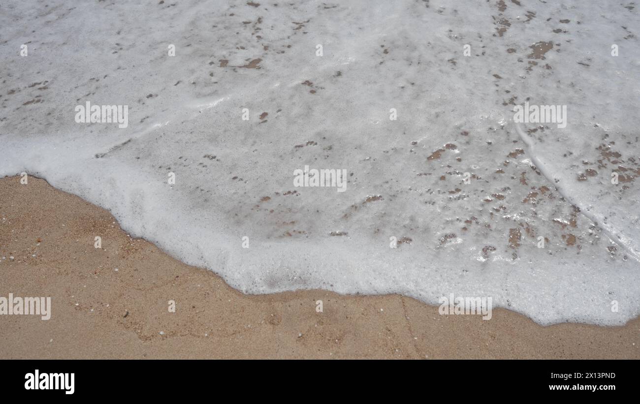 Foamy ocean wave washing sandy hi-res stock photography and images - Alamy