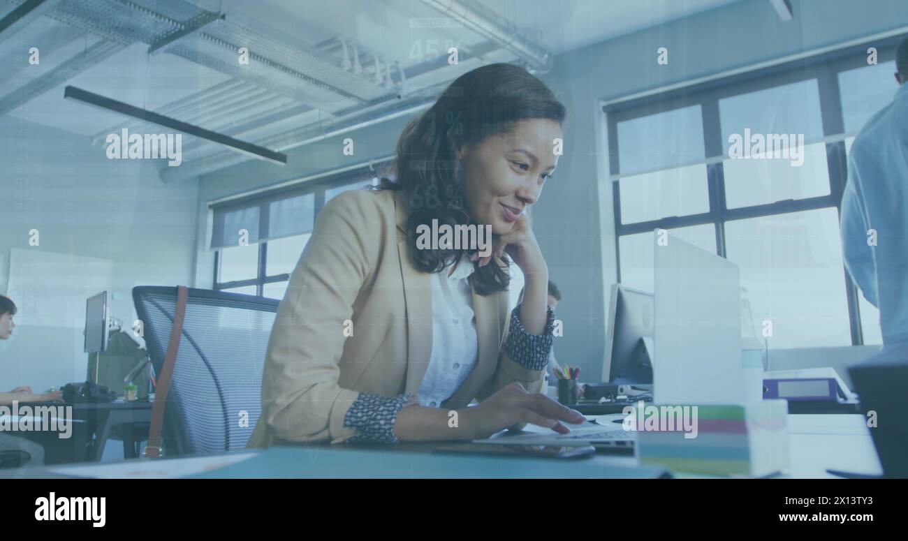 Business people using laptops in an office Stock Photo