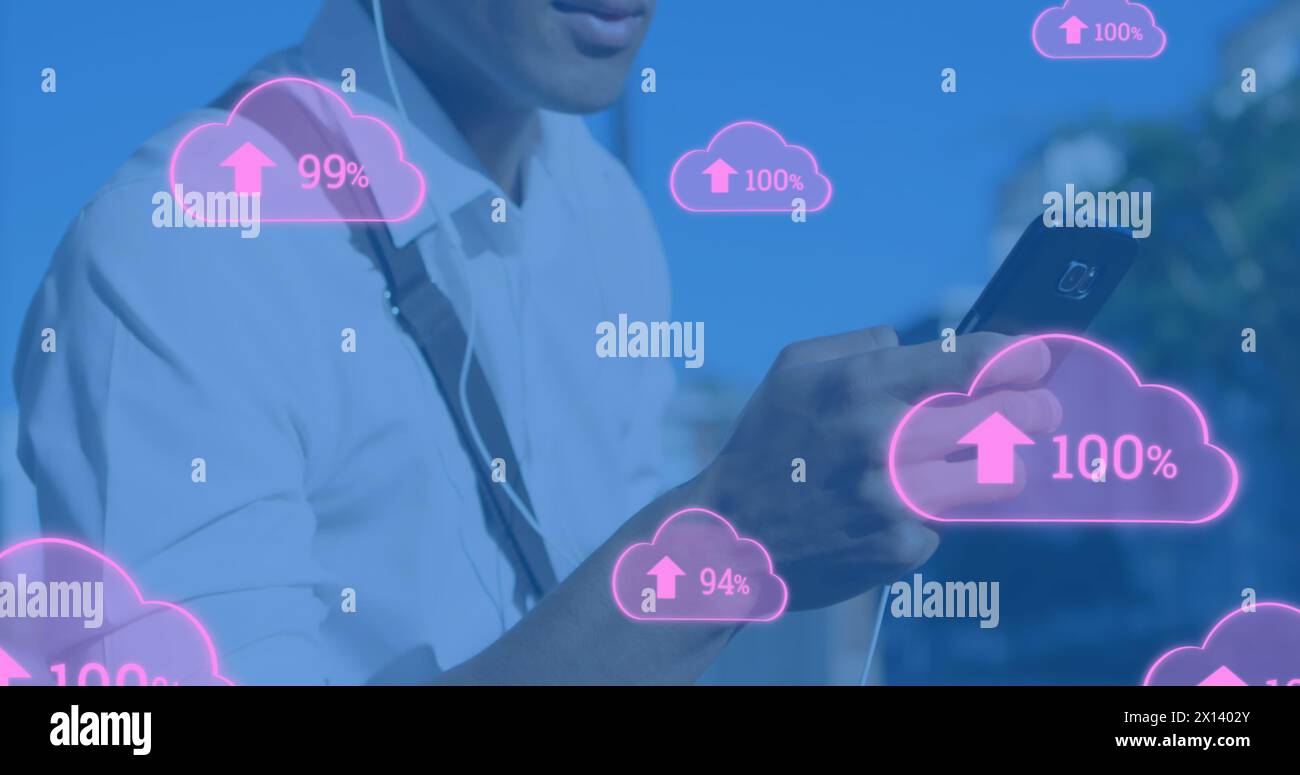 Image of digital clouds with percent going up over man using smartphone Stock Photo