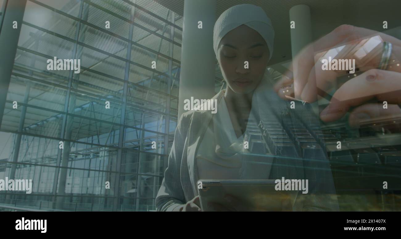 Image of women using computer over muslim businesswomen Stock Photo - Alamy