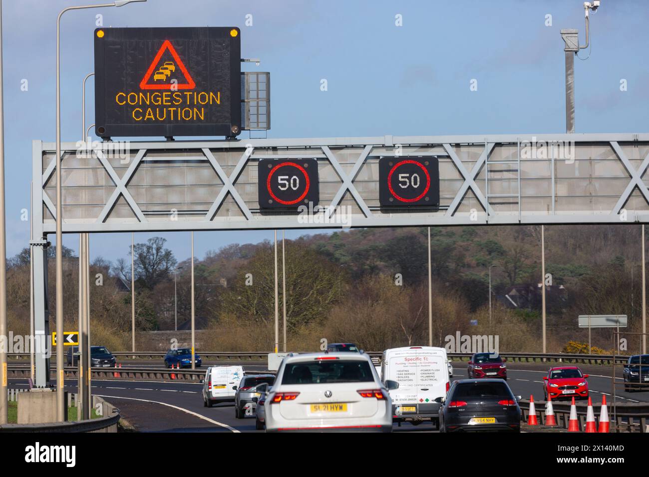 overhead gantry signs on the M90 near Edinburgh warning of congestion Stock Photo