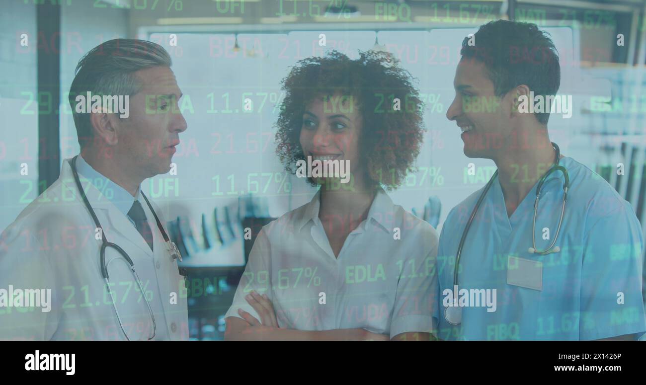 Image of data processing over diverse group of doctors Stock Photo