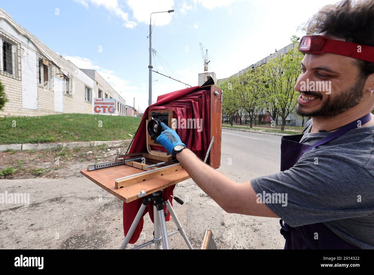 Non Exclusive: KHARKIV, UKRAINE - APRIL 13, 2024 - Italian photographer Alessandro Parente captures the aftermath of Russian aggression using an ancie Stock Photo