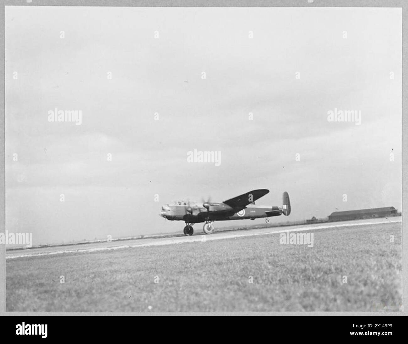 MEN OF SWINDON'S LANCASTER SQUADRON OFF ON AN OFFENSIVE - 8963 The bomber taking off Royal Air Force Stock Photo