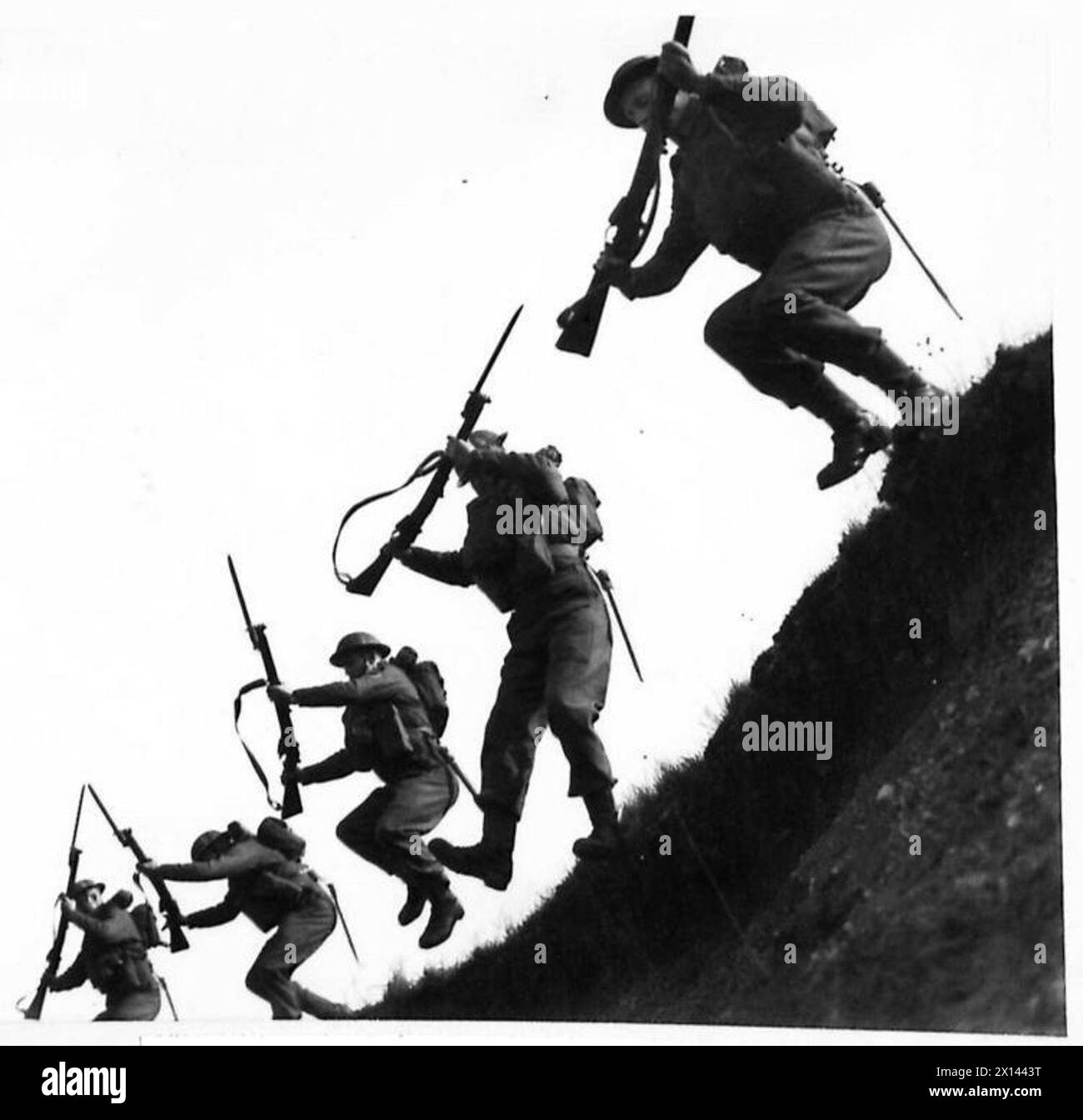 British Army infantry conduct an assault exercise, advancing rapidly in ...