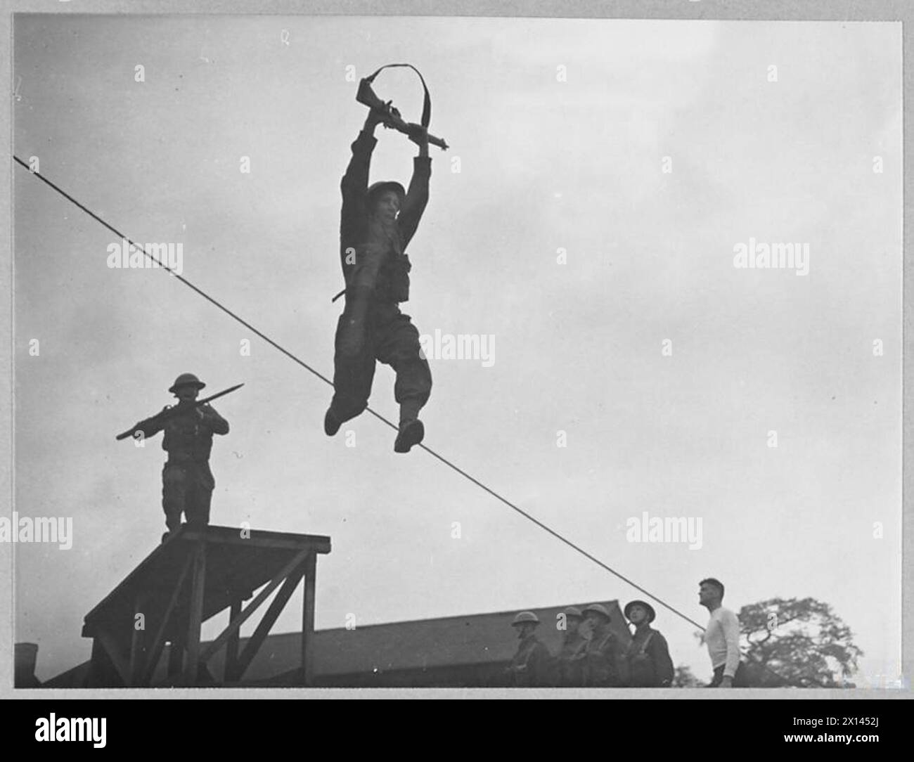 Airman Basic Rope An RAF Regiment airman completes a practice jump from a high platform ...