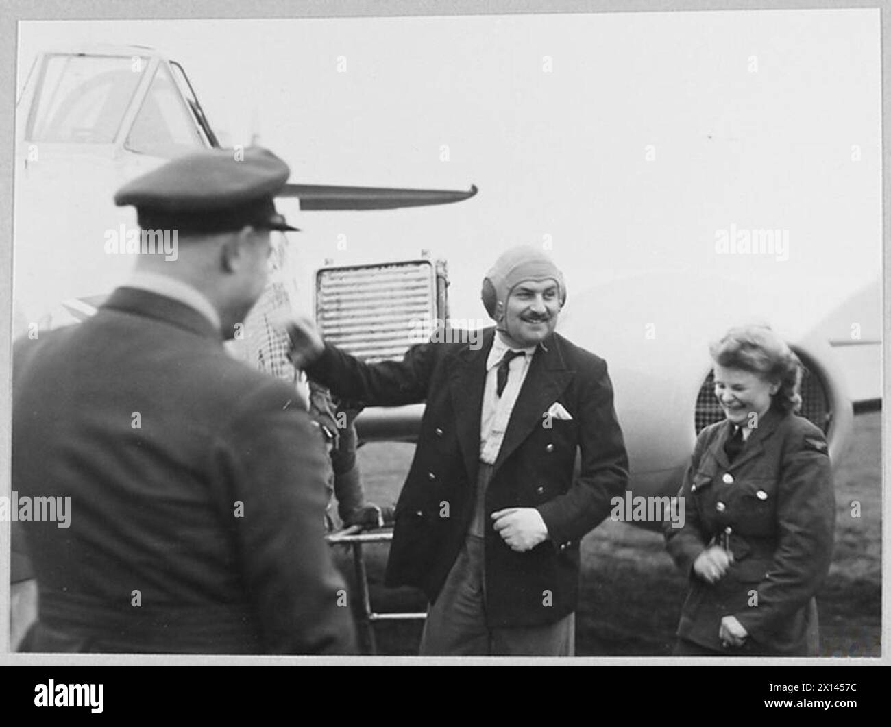 METEOR BREAKS SPEED RECORD - 16622 A satisfied smile from Mr. Eric Greenwood after averaging 606 m.p.h. The delighted W.A.A.F. is Aircraftwoman Margaret Woodfield, of Denehurst Gardens, Richmond Royal Air Force Stock Photo