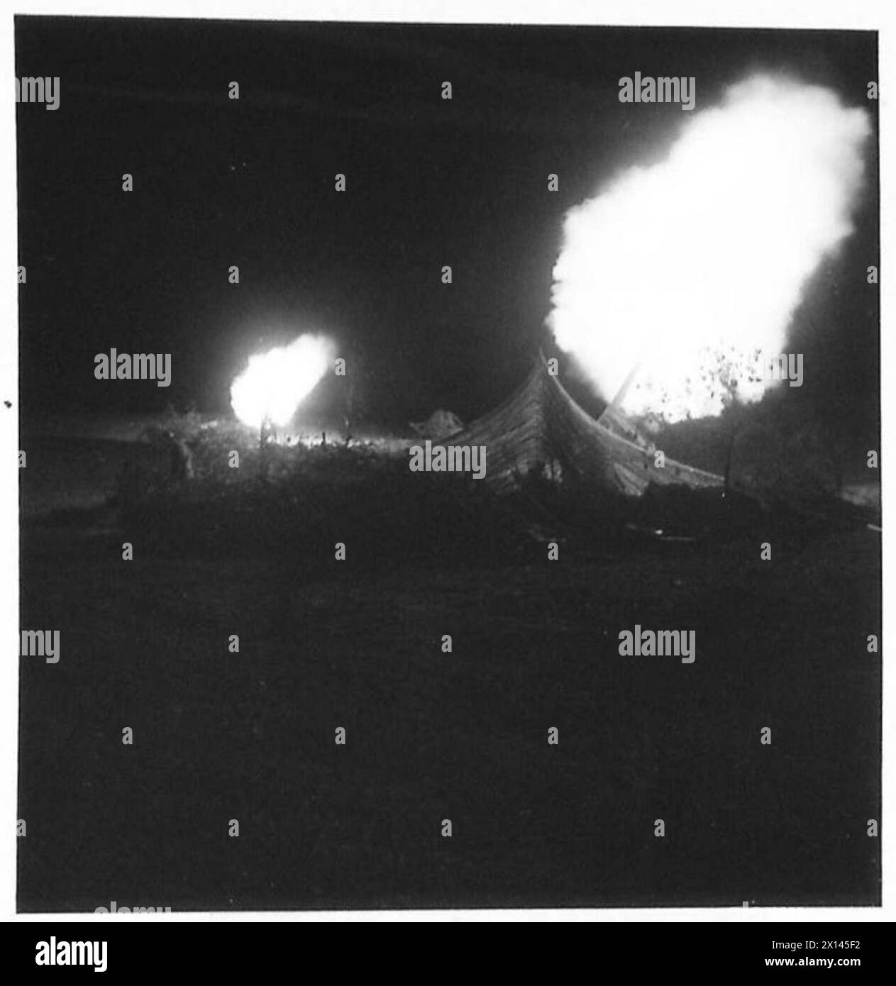The Eighth Army opens a night barrage with heavy guns during the Mareth Line battle, capturing 1,700 prisoners in the early stages. Stock Photo