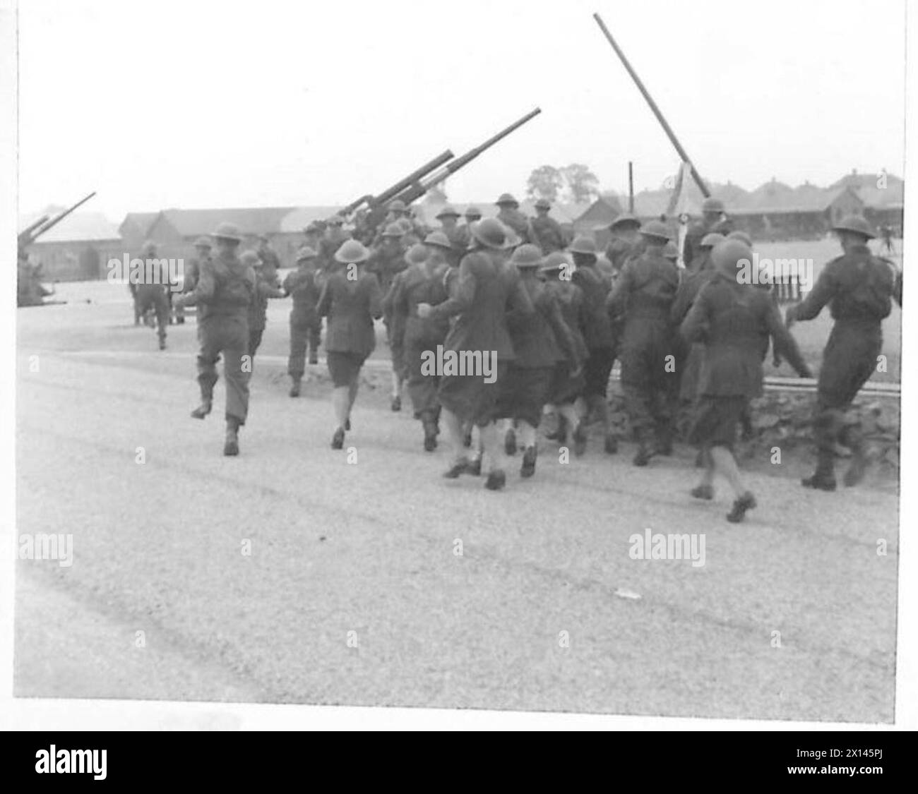 ATS personnel and gunners respond to an alert by manning anti-aircraft ...