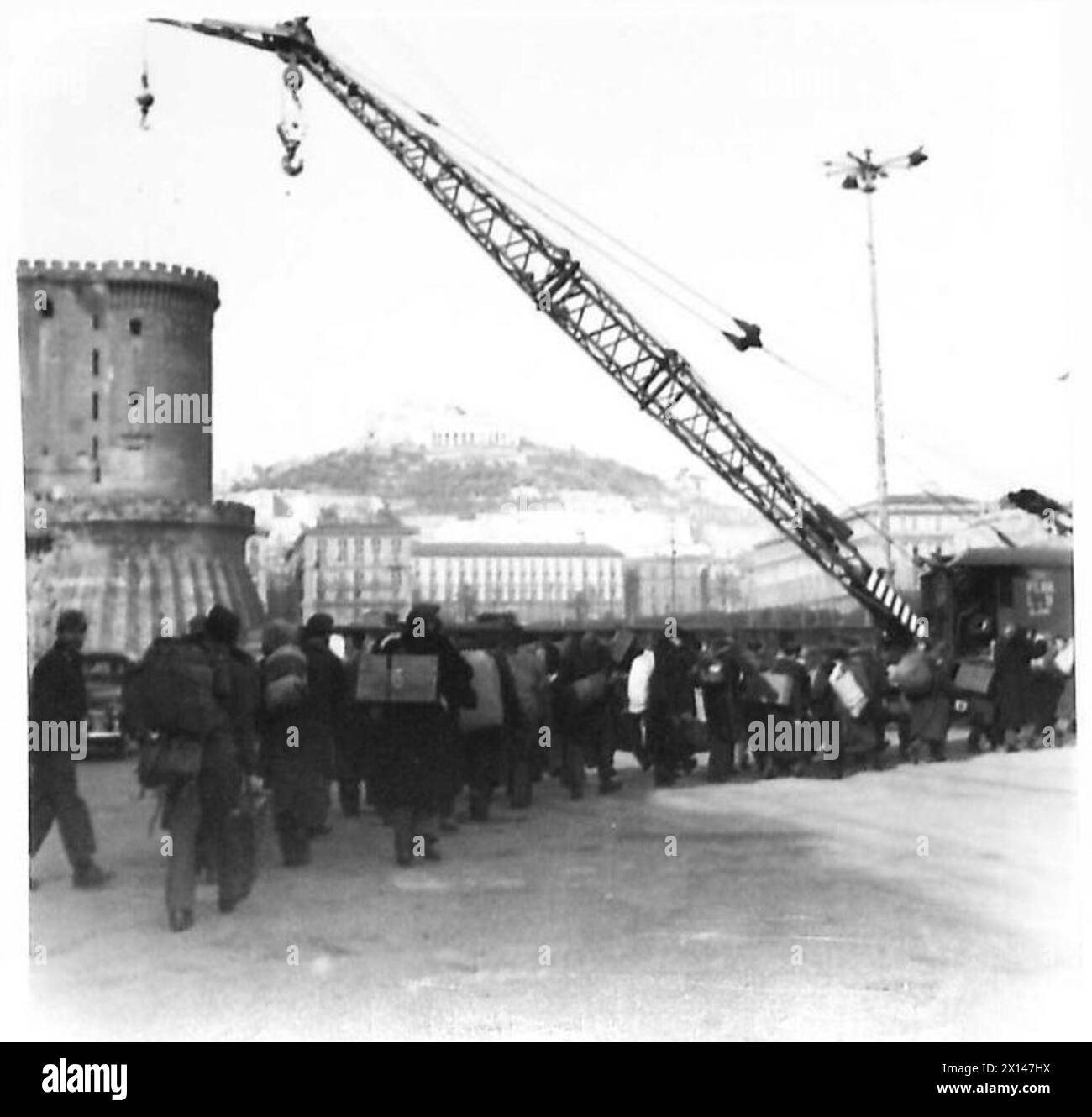 ITALIAN REPATRIATES ARRIVE - Part of the 5,000 ex-Italian POWs file away at Naples docks after disembarking from the Georgio British Army Stock Photo