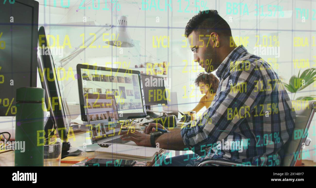 Composite of financial data processing over businessman using computer in office Stock Photo