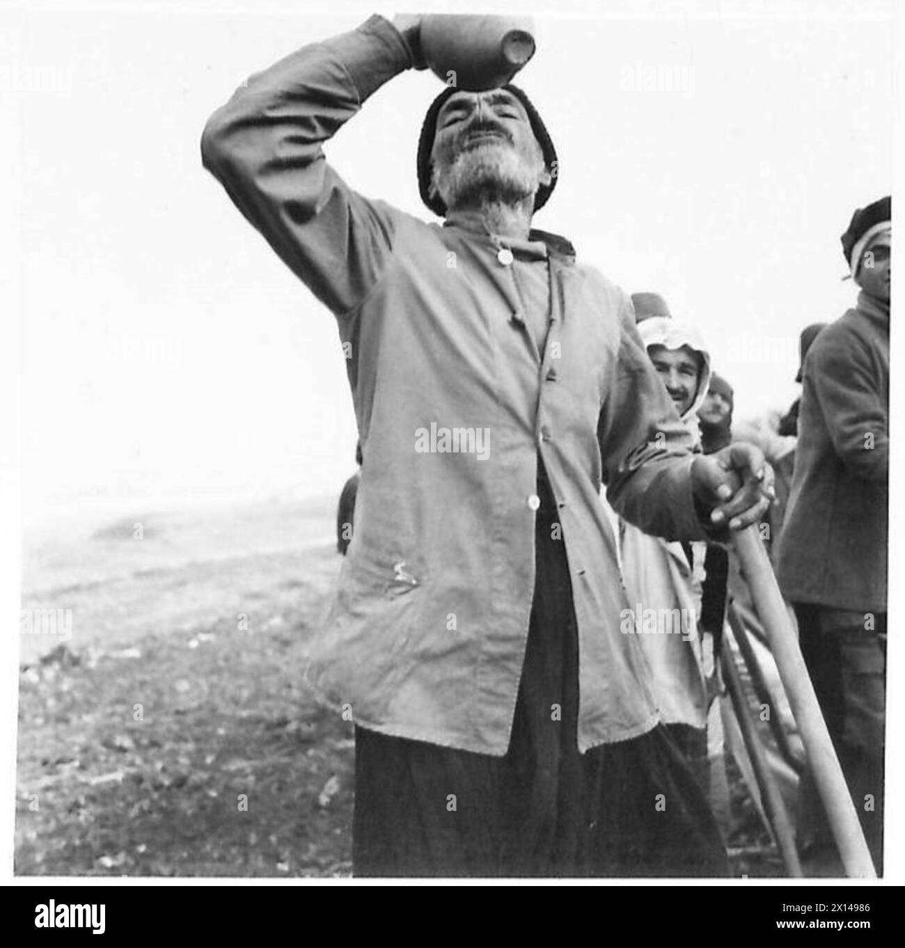 BUILDING THE HAIFA-TRIPOLI RAILWAY - A local Arab taking a cooling ...