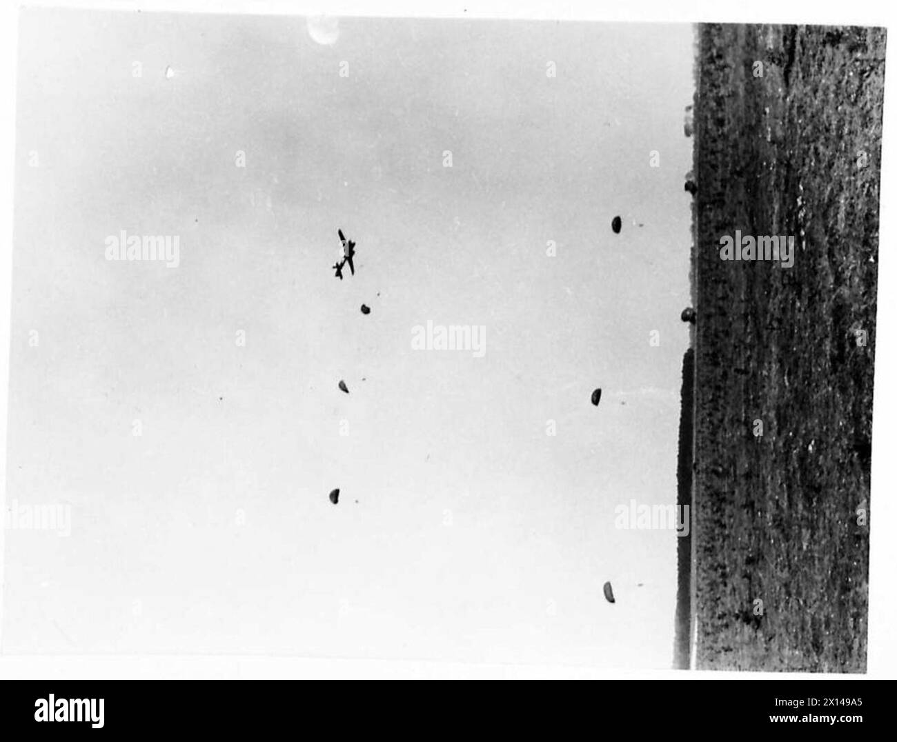 GLIDER AND PARATROOP DEMONSTRATION - Parachute troops being dropped from Whitleys British Army Stock Photo