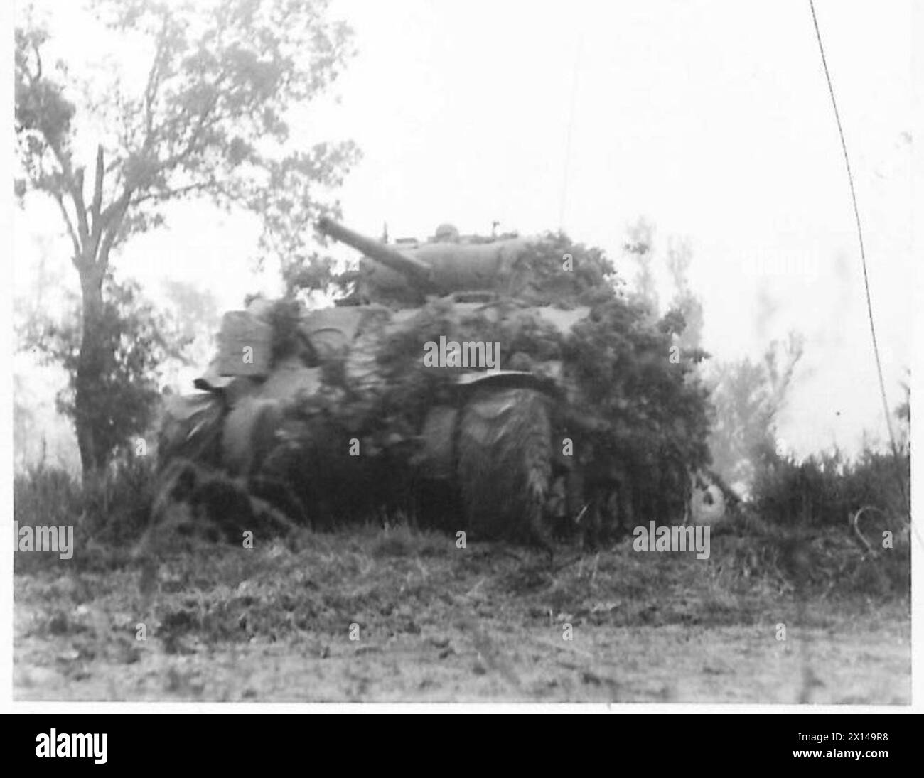 Sherman tanks of the Eighth Army advance toward a bridge across the River Liri under smoke screens, facing mortar and machine gun fire during the Allied attack on the Gustav Line in Italy. Stock Photo