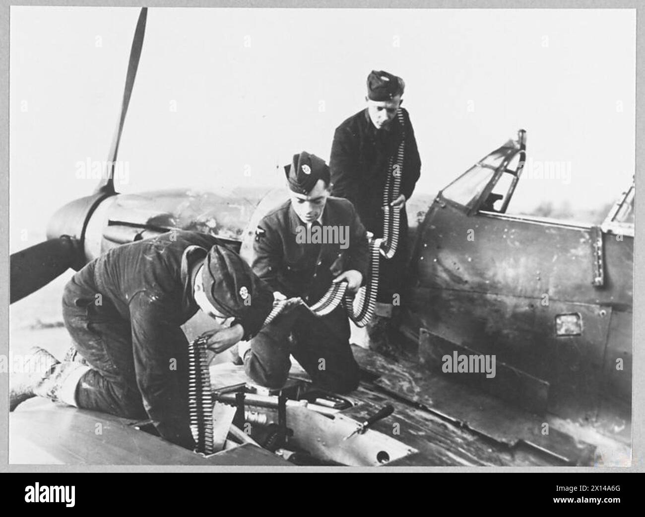 THE BATTLE OF BRITAIN 1940 - Armourers re-arming a Hurricane of No. 601 ...