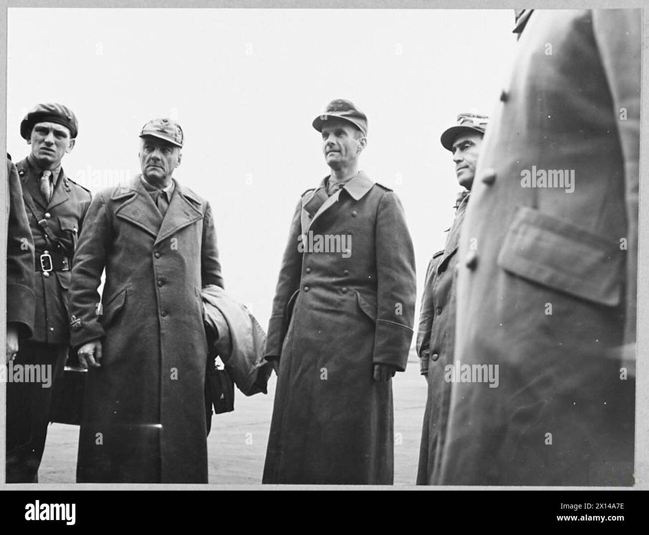 AXIS GENERALS ARRIVE IN SOUTH OF ENGLAND AS PRISONERS OF WAR. - 9958. Picture (issued 1943) shows - Brigadier General Costa [left] and Colonel von Hulsen being asked if they have had a comfortable journey and is they have any complaints Royal Air Force Stock Photo