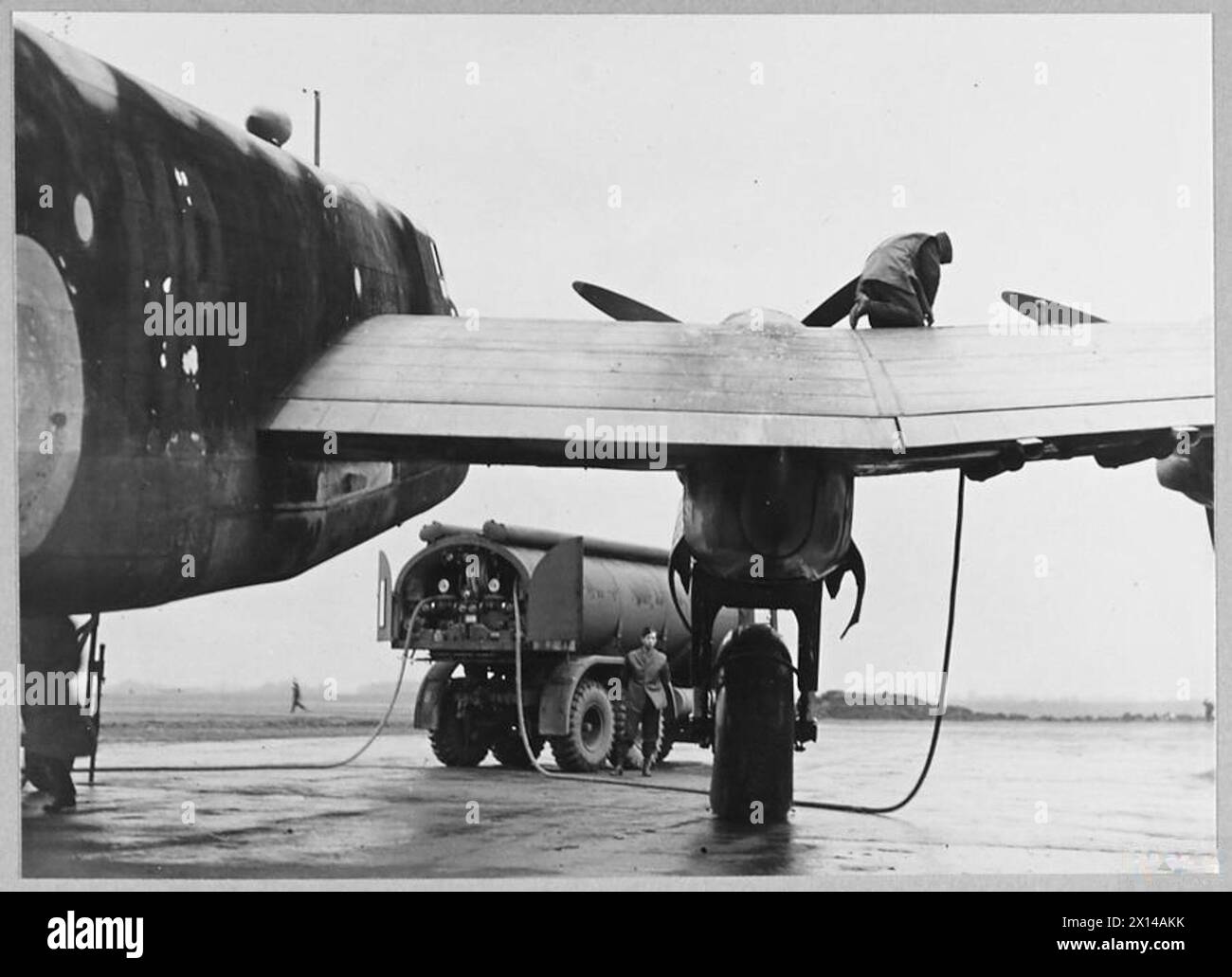 A HALIFAX & WHITLEY BOMBER STATION OF THE ROYAL AIR FORCE. - Refuelling ...