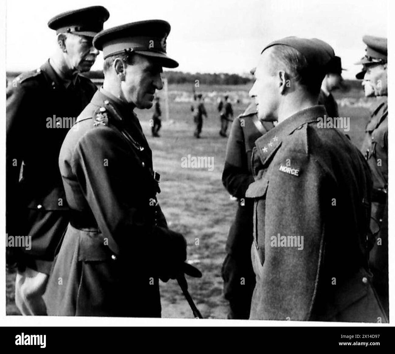The Commander-in-Chief speaks to a Norwegian officer during British ...