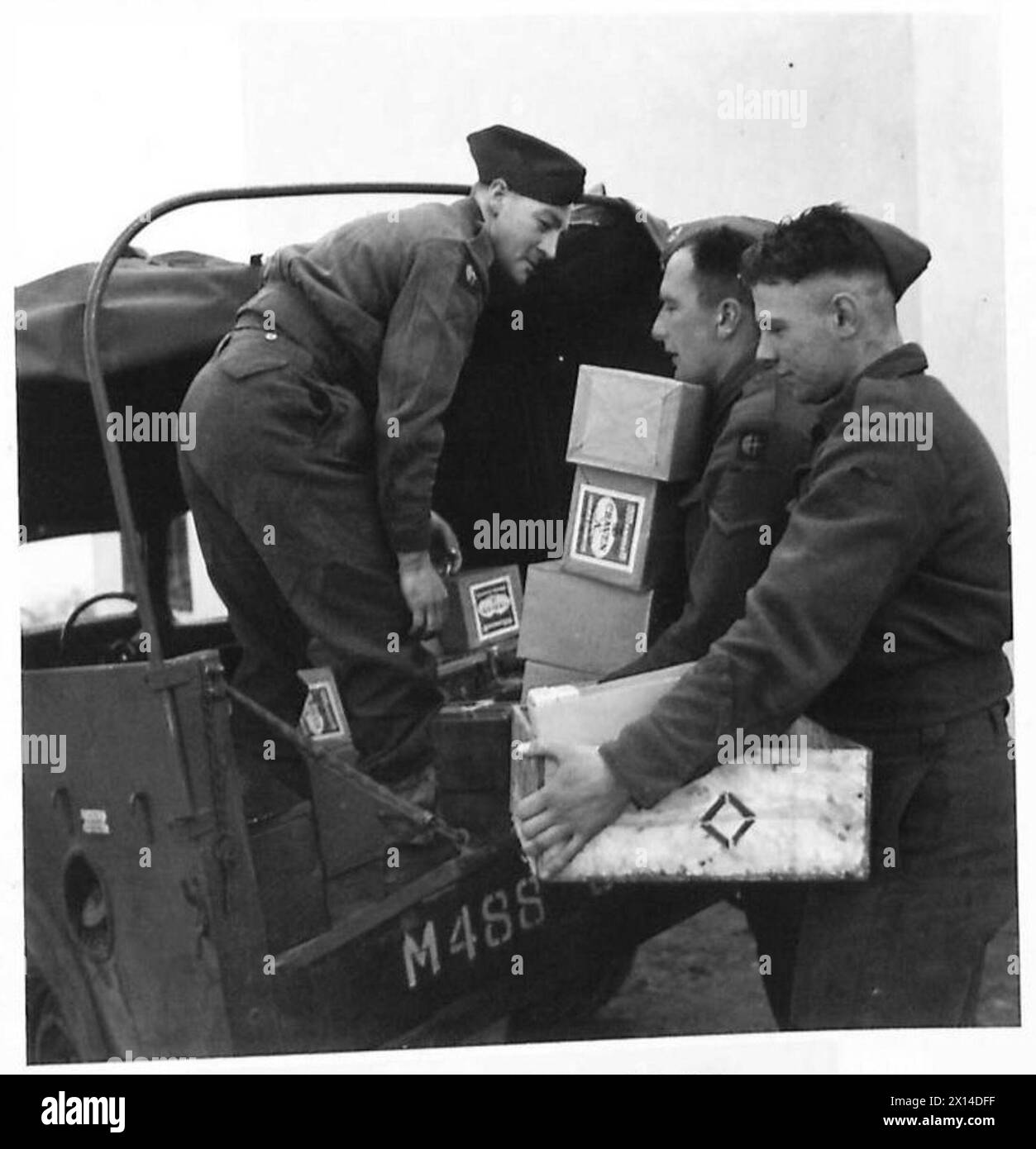 NAAFI SUPPLIES FOR FRONT LINE UNITS - Men from one of the units loading their truck with their weekly supplies British Army Stock Photo