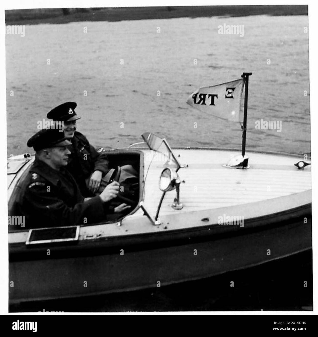 HOME GUARDS DEFEND INLAND WATERWAYS - Speedboats are used by the Trent River Patrol for collecting messages from the launches and rushing them back to H.Q. Here a speedboat crew are seen receiving a message from a launch and conveying it to H.Q British Army Stock Photo