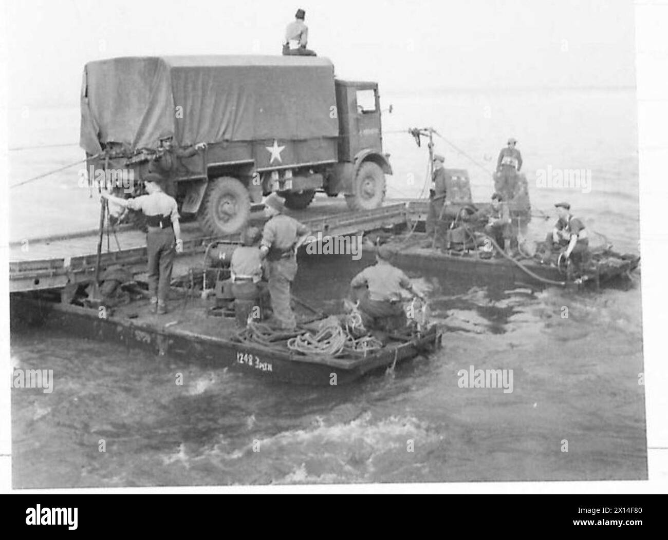 A lorry is transported on a raft across the Rhine towards the east bank ...