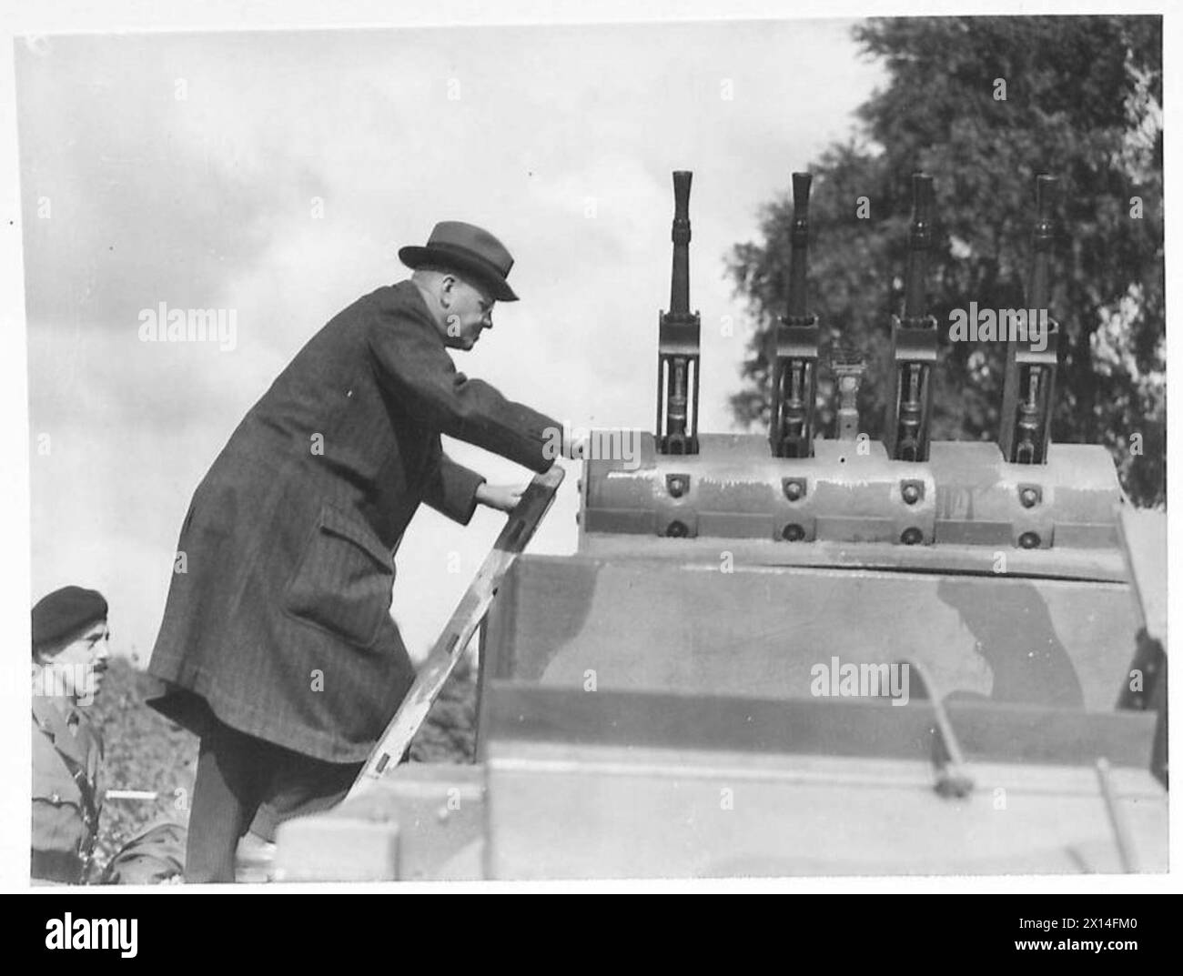 Major General Wesson inspects an A.A. Light Tank Mark IV (B) as part of ...