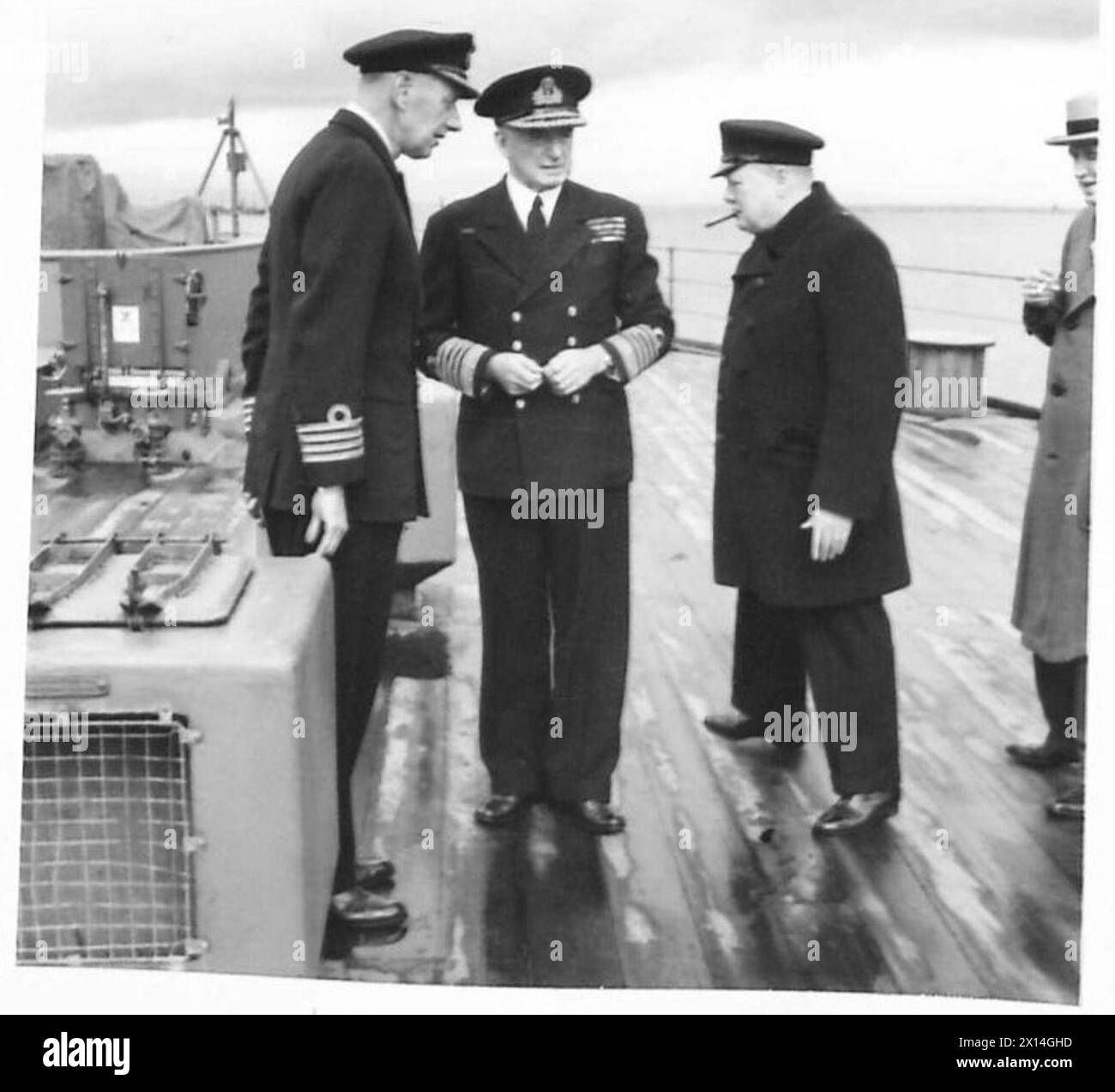 THE PRIME MINISTER AND PARTY ON THEIR WAY ACROSS THE ATALANTIC TO MEET PRESIDENT ROOSEVELT - The Prime Minister, Captain J.C. Leach (Captain of HMS Prince of Wales) and Admiral Sir Dudley Pound (1st Sea Lord) on board HMS Prince of Wales British Army Stock Photo