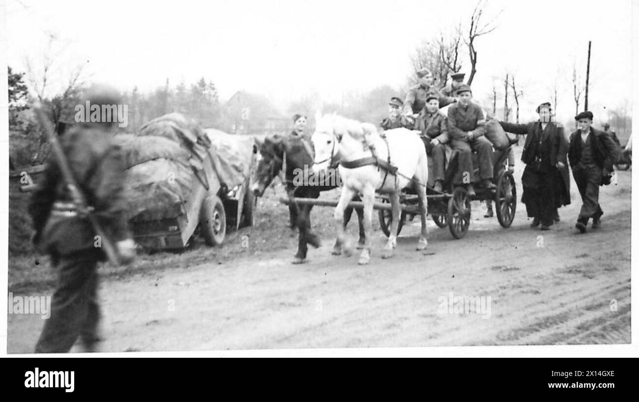 ON THE WAY TO COESFELD - Some German prisoners, including members of the Todt organisation, drive themselves to surrender in a horse drawn cart British Army, 21st Army Group Stock Photo