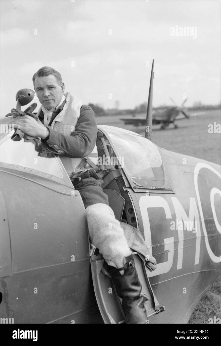 ROYAL AIR FORCE: 2ND TACTICAL AIR FORCE, 1943-1945. - Group Captain A G 'Sailor' Malan, Officer Commanding No. 145 Wing based at Merston, climbing in to the cockpit of his Supermarine Spitfire before taking off from Appledram, Sussex Malan, Adolph Gysbert, Royal Air Force, Wing, 142, Royal Air Force, Maintenance Unit, 201 Stock Photo
