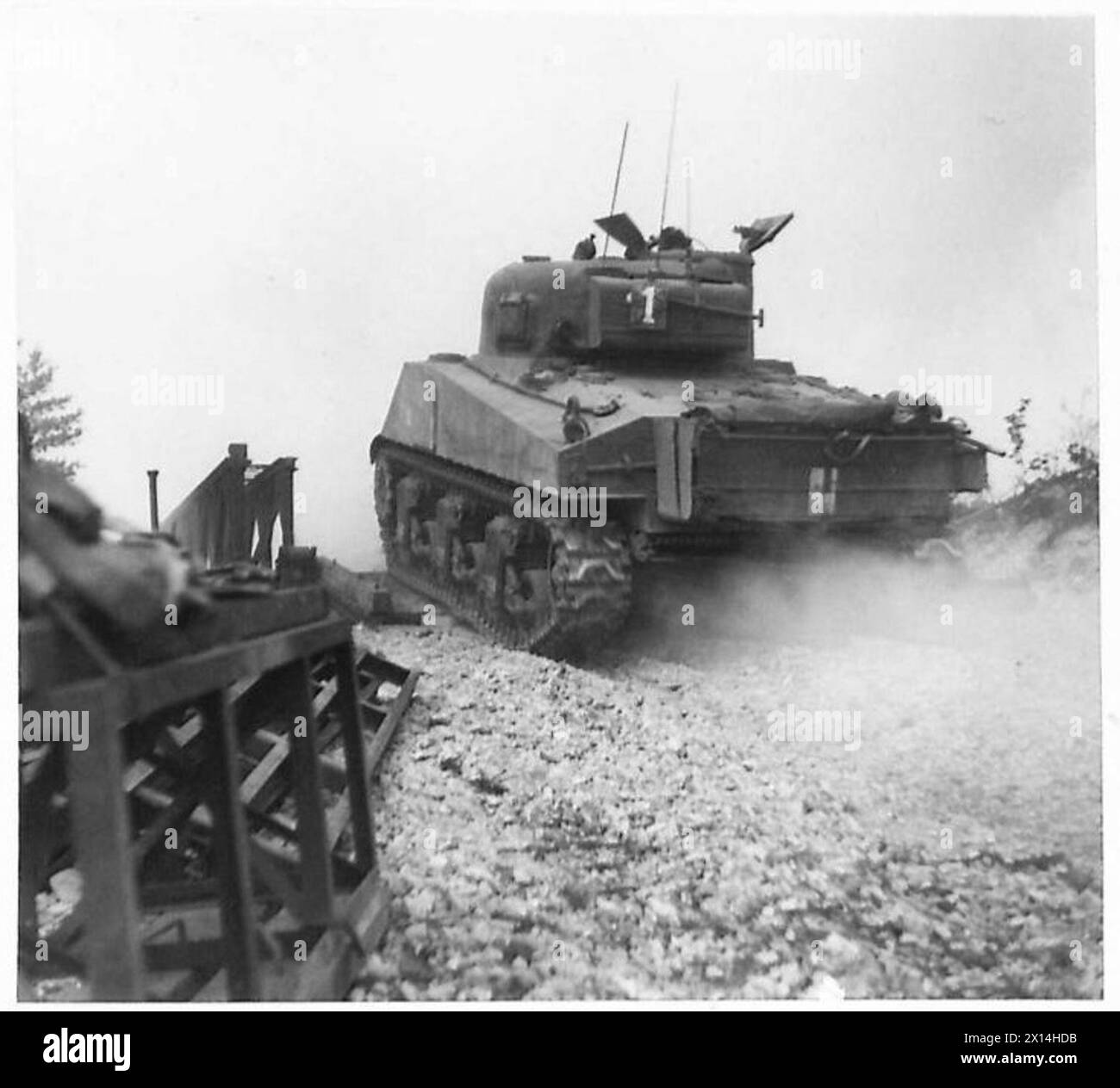 A Sherman tank crosses a Bailey bridge under a heavy smoke screen during the Eighth Army's assault on the Gustav Line in Italy. Stock Photo