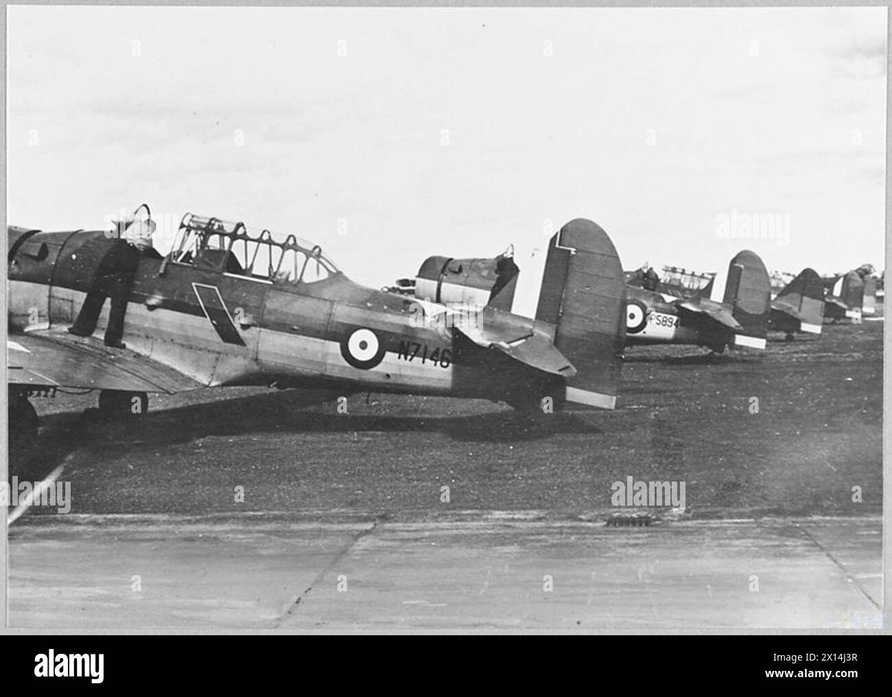American Harvard aircraft are prepared for RAF training flights, used ...