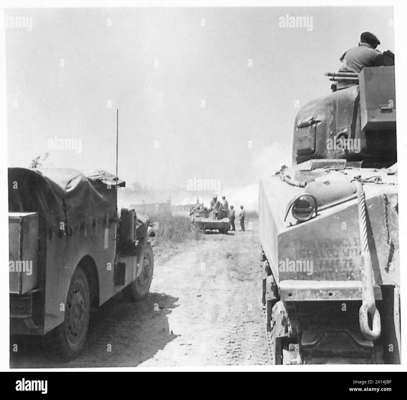 Armoured units approach the Oxford Bridge over the River Gari ...