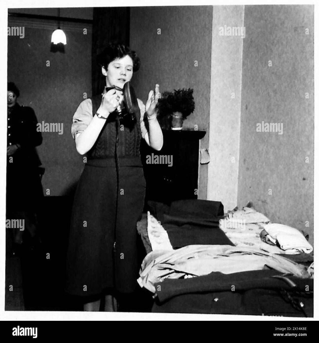 ATS "RED CAPS" IN NORTHERN IRELAND - A Red Cap prepares to press her