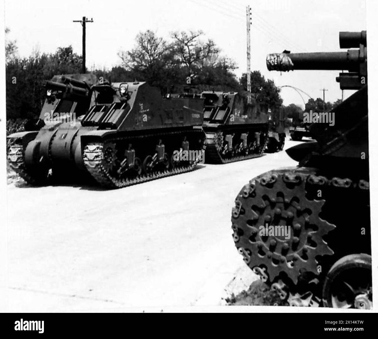 Two Gun Tank Sherman tanks and Priest self-propelled guns of No.17 Armoured Fighting ...
