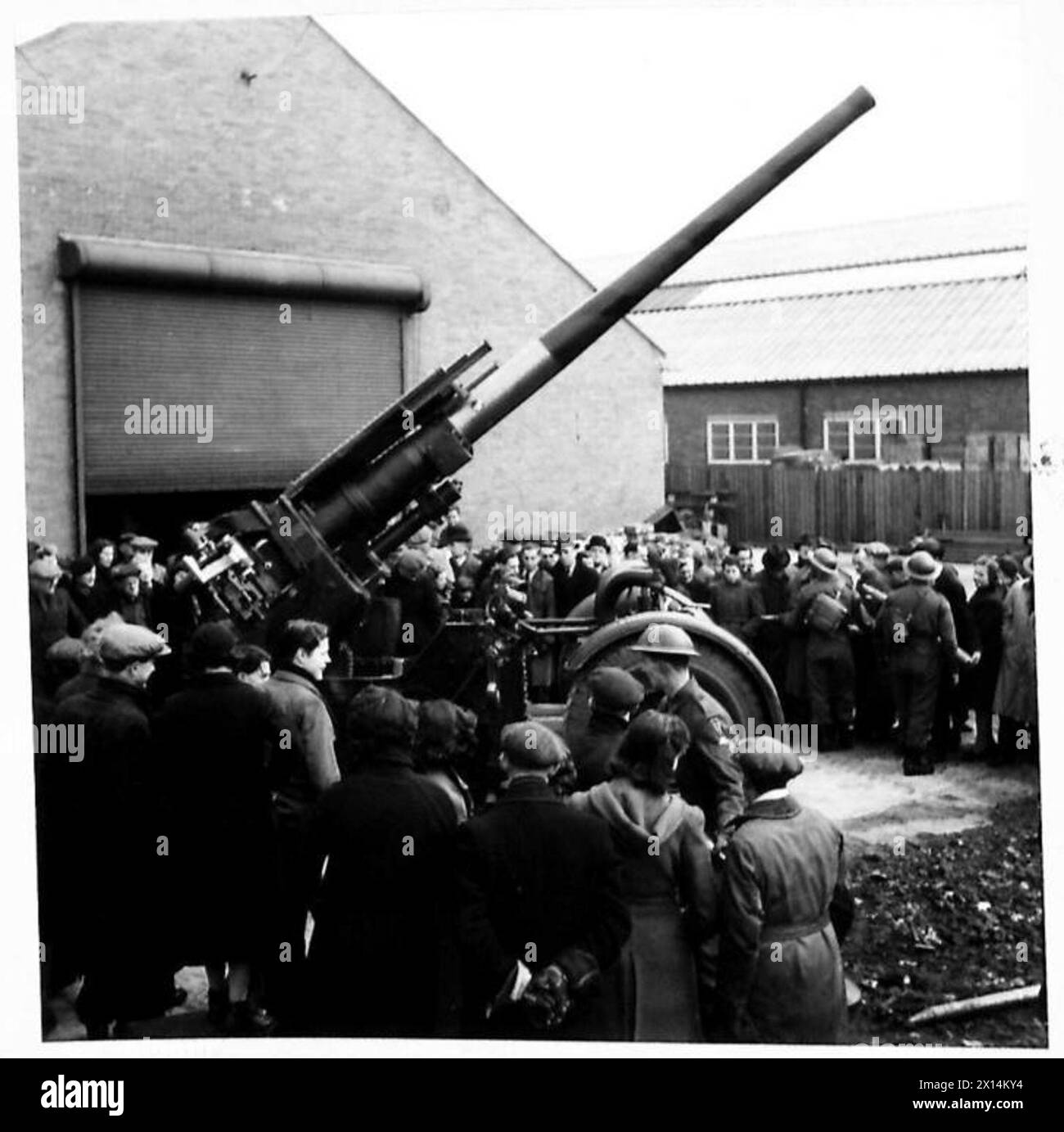 FACTORY WORKERS SEE THE FINISHED ARTICLE - Some of the workers round a