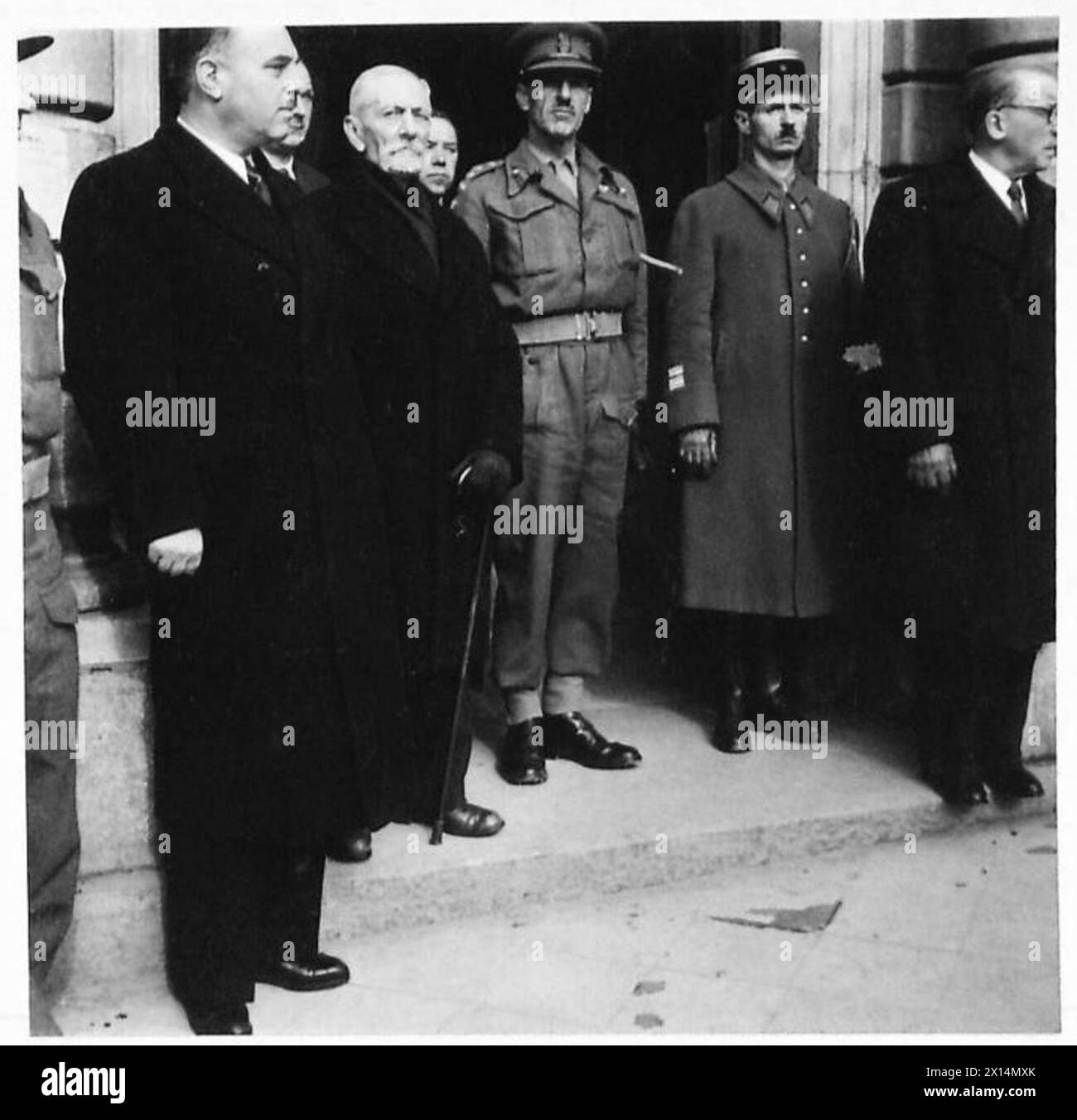 MAYOR OF BOULOGNE ATTENDS HIS FIRST PUBLIC CEREMONY. - L-R: M. Pierre Hars, assistant Prefect of Police of Boulogne, M. Eugne Canu, the new Mayor of Boulogne, Lt-Col. Texier representative of the British Military Affairs, Commandant of Police and members of the Boulogne Officials controlling the Town British Army, 21st Army Group Stock Photo