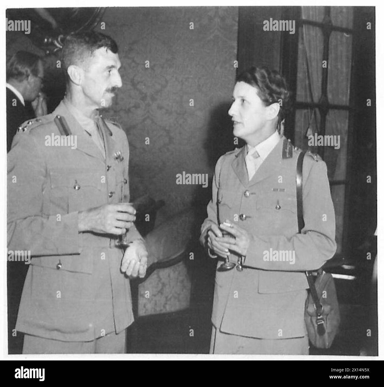 DIRECTOR A.T.S. IN ITALY - Mrs. Whateley and Brigadier Low together at a dinner at the Hotel Ambassy British Army Stock Photo