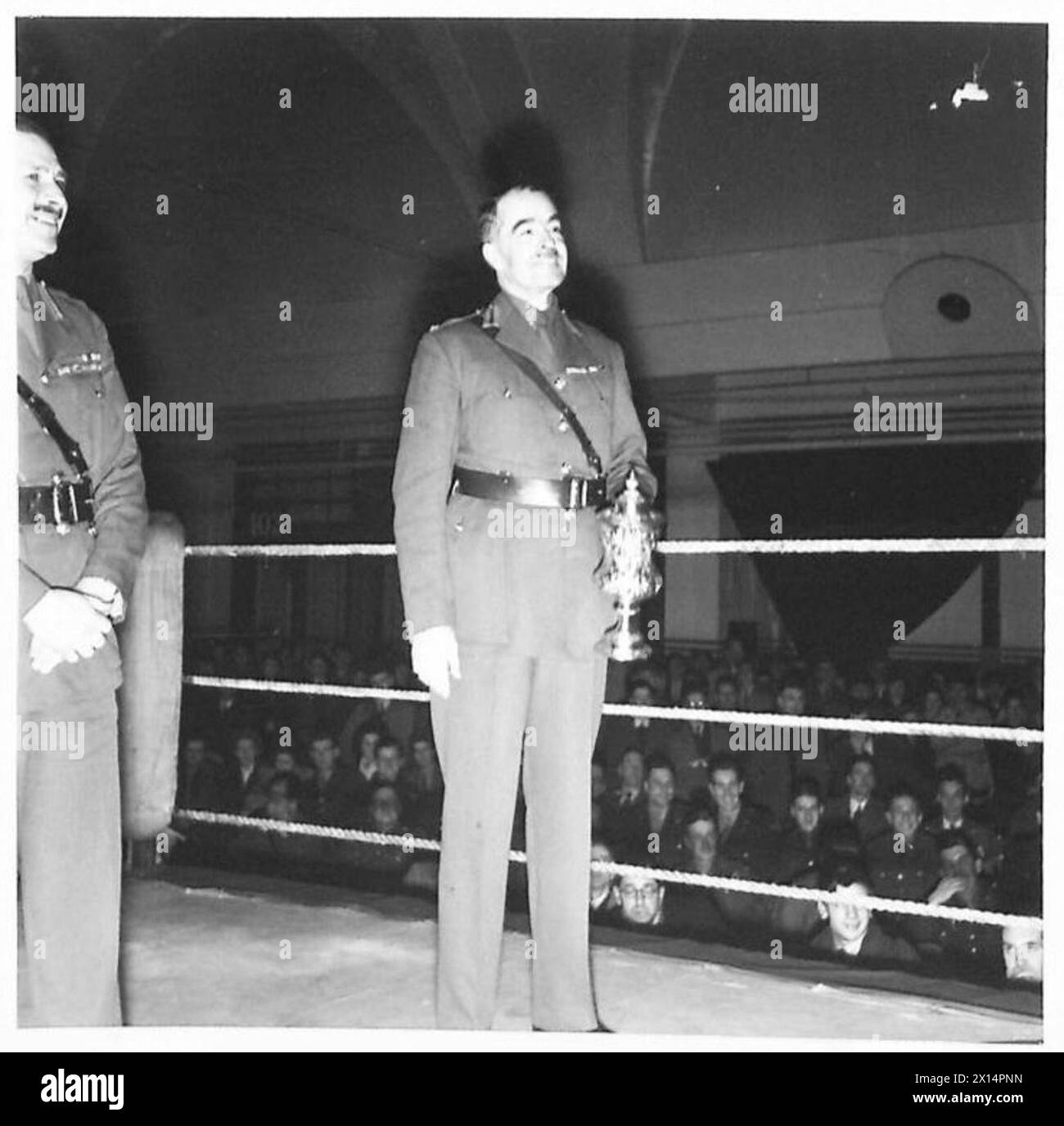 MILITARY BOXING TOURNAMENT - Brigadier A.F.B. Hopwood (DDME) is seen holding the cup which his team REME had won British Army Stock Photo