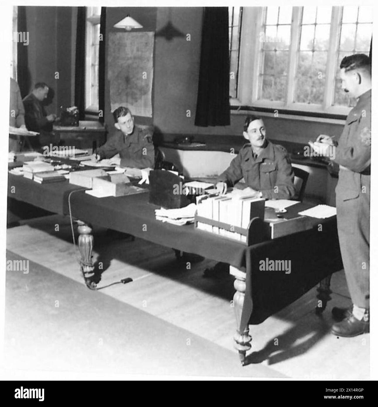 A VISIT TO A BATTALION OF THE SCOTS GUARDS - An officer giving ...