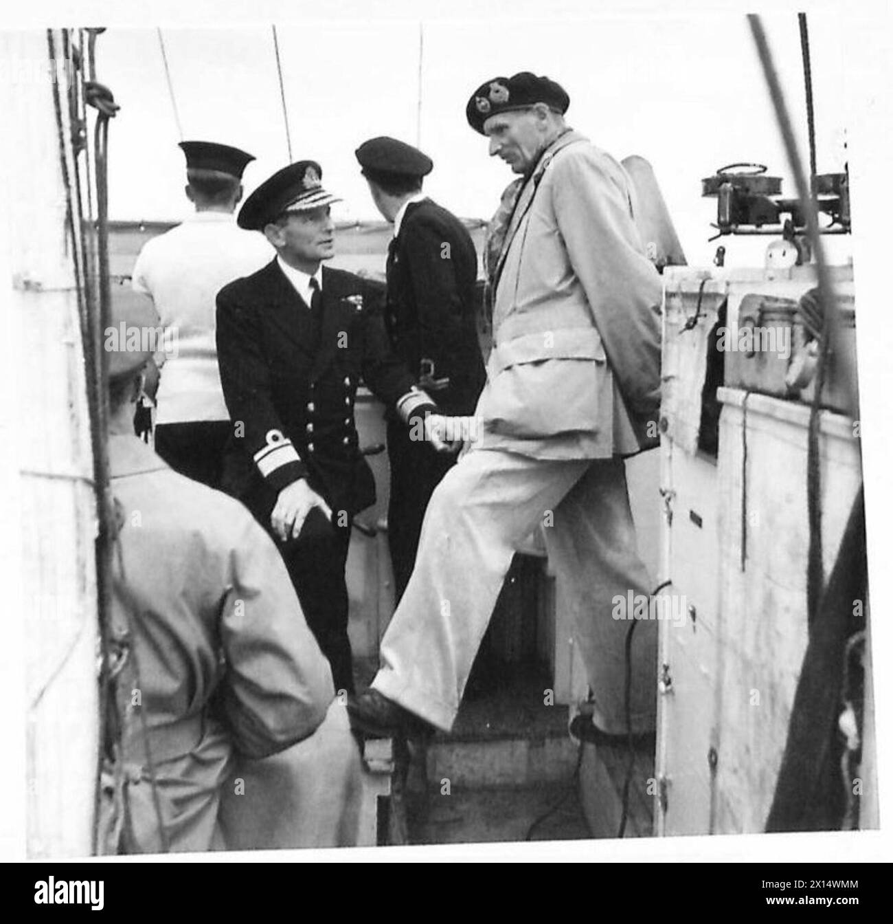 GENERAL MONTGOMERY VISITS HMS RODNEY - The General with Rear Admiral Rivett Carnac on the bridge of the ML in which he made the journey out to HMS Rodney British Army, 21st Army Group Stock Photo