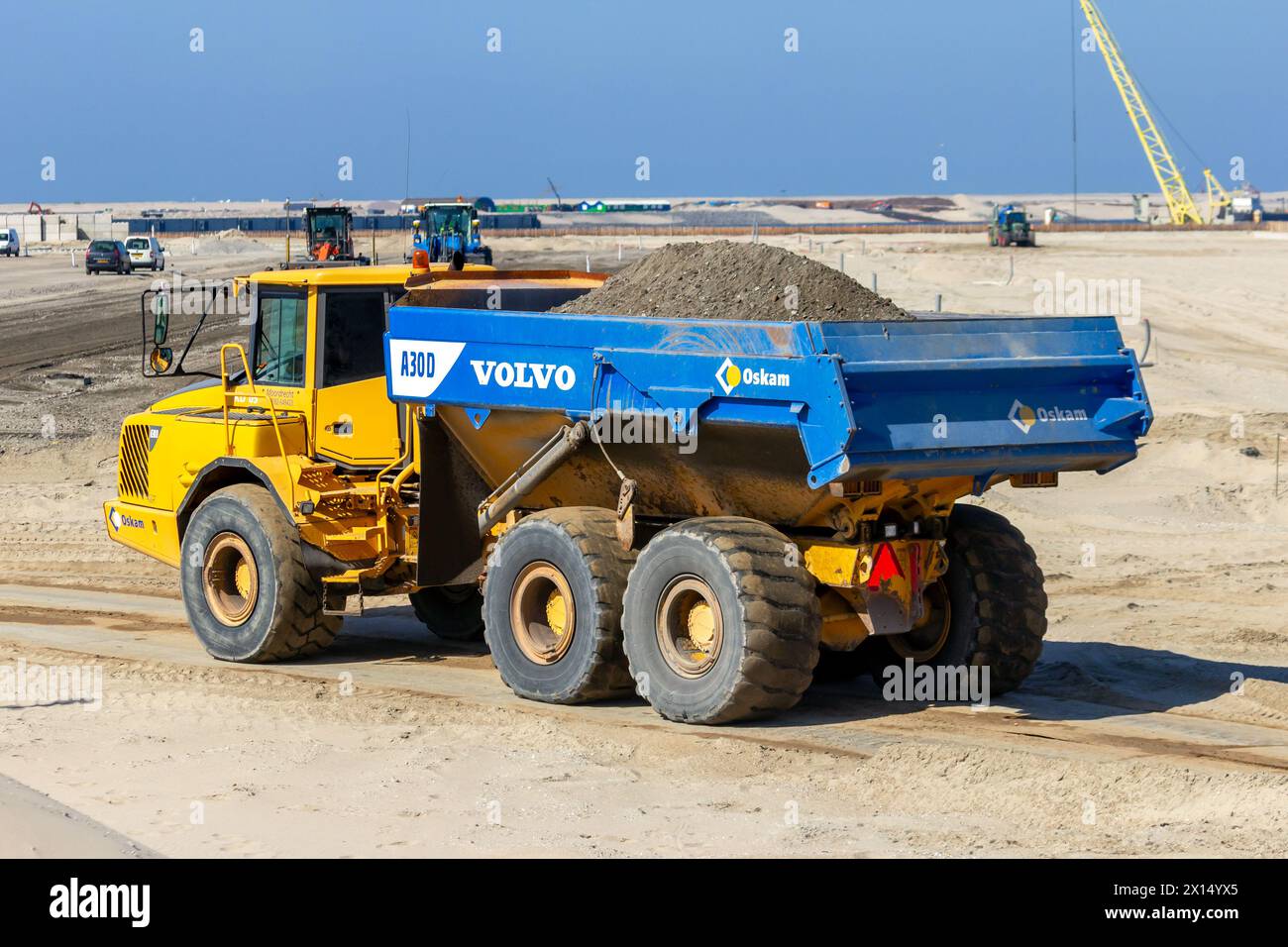 Volvo A30D Articulated Dump Truck at the construction of Maasvlakte 2 in the Port of Rotterdam. The Netherlands - Sep 7, 2012 Stock Photo