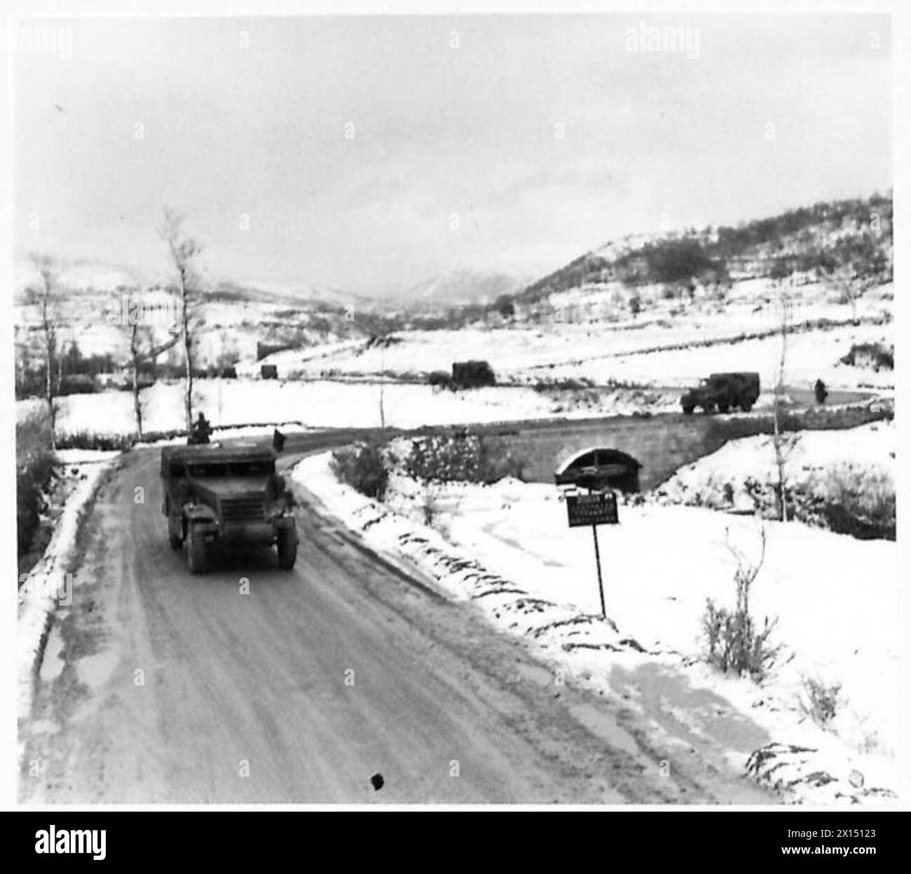 THE POLISH ARMY IN THE ITALIAN CAMPAIGN, 1943-1945 - A convoy of the 3rd Carpathian Rifles Division (2nd Polish Corps) trucks moving along the Carpinone - Agnone road in the snow covered lanscape (despite of the first week of the spring), 25 March 1944. A M3 Scout Car is leading the convoy Polish Army, Polish Armed Forces in the West, Polish Corps, II, Polish Armed Forces in the West, Carpathian Rifles Divisior, 3, 8th Army Stock Photo