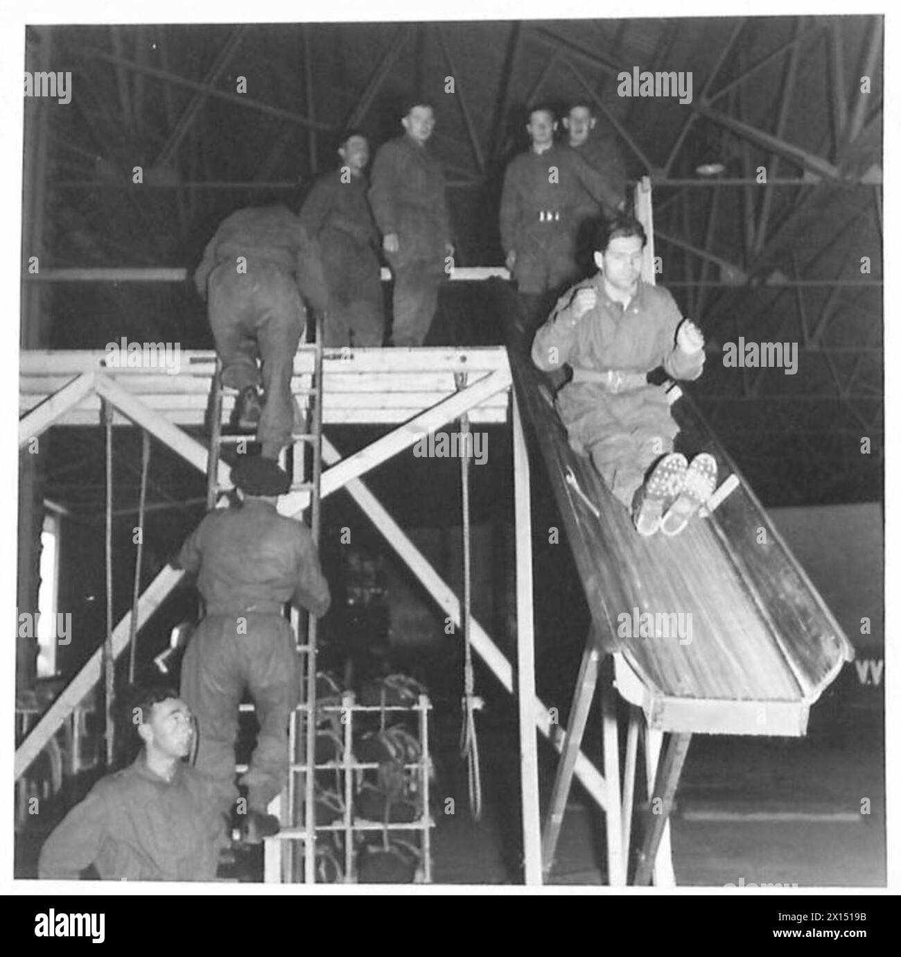 Fall And Roll PARATROOPS IN TRAINING - By means of a slide, recruits are shown how to ...