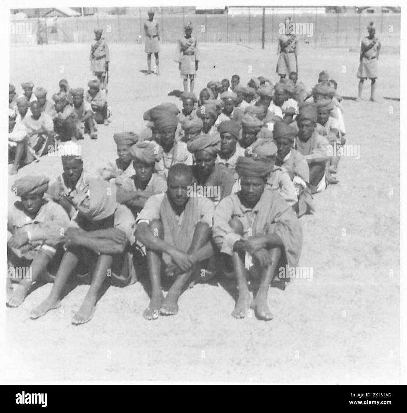 ETHIOPIAN WARRIORS AID BRITISH TROOPS - Fascist native auxiliaries captured by British patrols during our regular forays into Abyssinia. Altogether 300 of them, including Eritrean, Gallas and Abyssinian conscripts have been rounded up during our recent actions inside enemy territory. The prisoners shown in the pictures were captured on the Aroma and Kassala fronts British Army Stock Photo