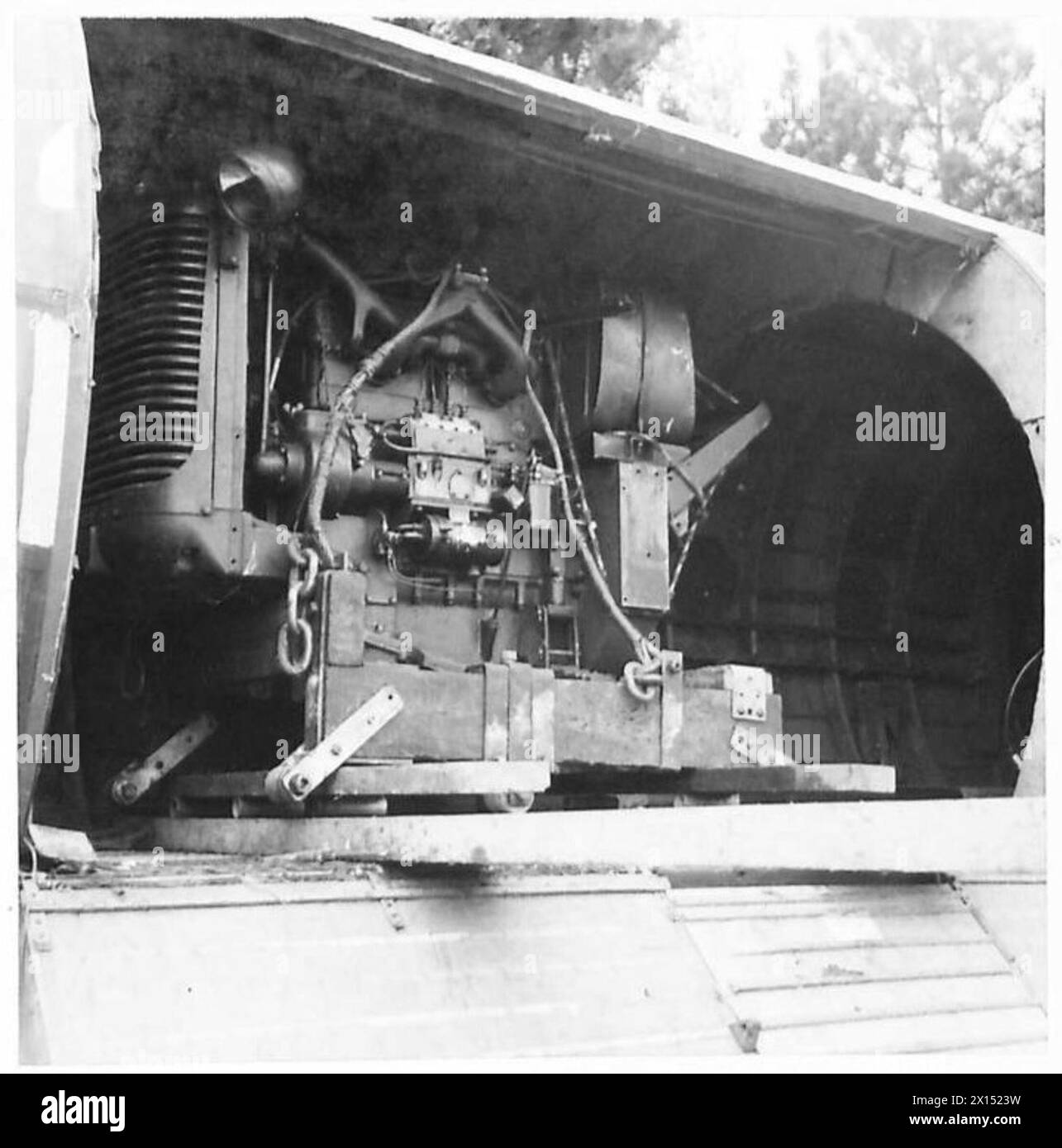 AIRBORNE DIVISION LASHING EQUIPMENT - The loading and unloading of a D.40 tractor into a Horsa glider British Army Stock Photo
