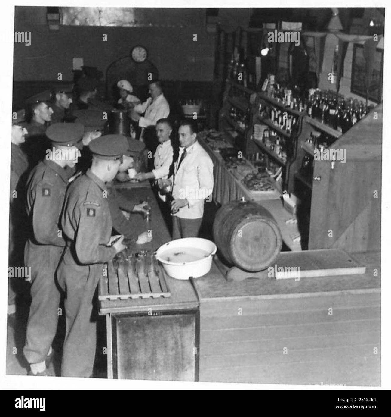 A VISIT TO A BATTALION OF THE SCOTS GUARDS - A visit to the NAAFI. During a break from duties some of the Guardsmen pay a visit to the NAAFI. Here almost anything may be purchased British Army Stock Photo