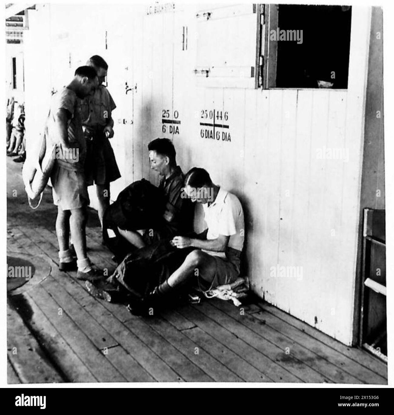 Ex-prisoners of war and civilian internees returning from Singapore sew ...