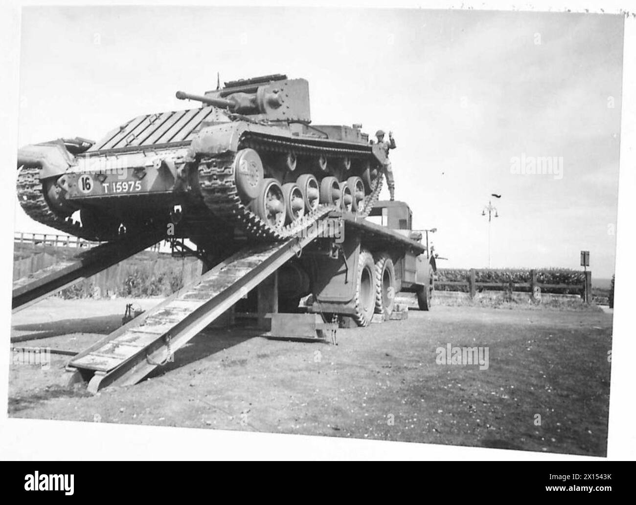 A TANK TRANSPORTER - Mark III "I" tank (Valentine) being hauled aboard