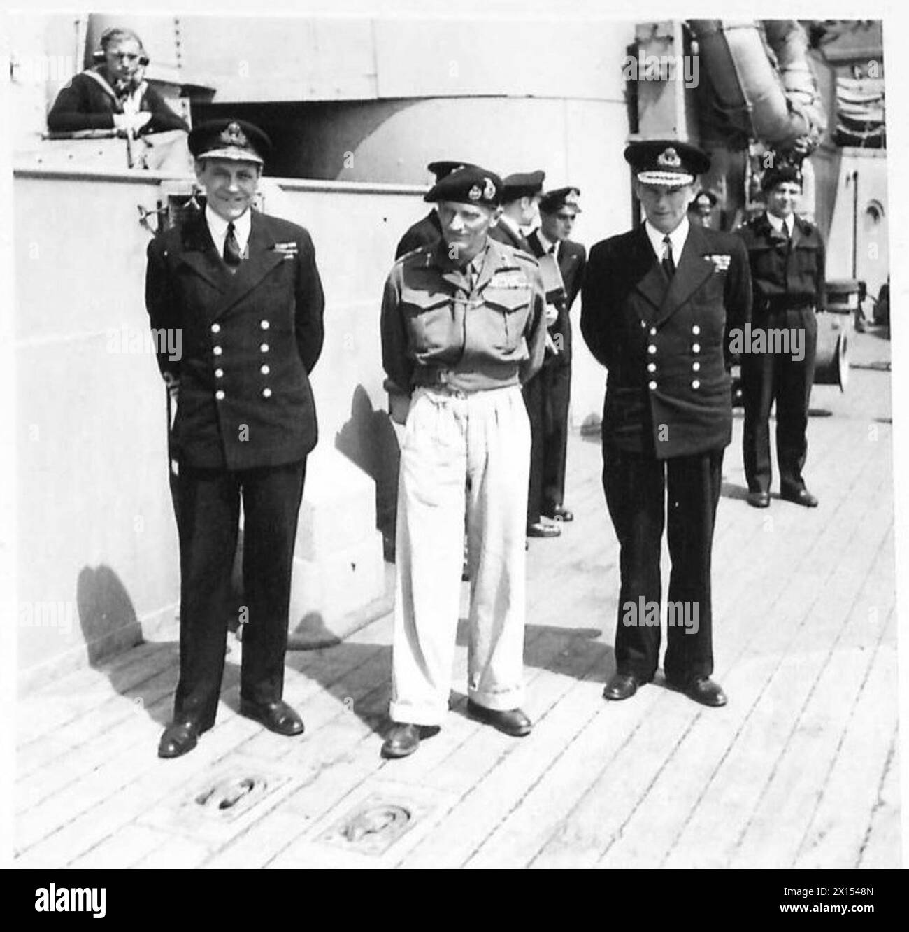 GENERAL MONTGOMERY VISITS HMS RODNEY - Left to right:- Vice Admiral Dalrymple Hamilton; General Montgomery and Rear Admiral Rivett Carnac photographed abourd HMS Rodney British Army, 21st Army Group Stock Photo
